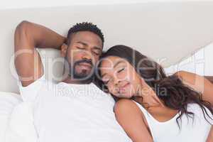 Happy couple on the bed sleeping