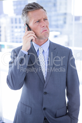 Angry businessman on the phone