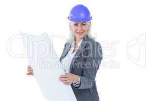 Selfassured businesswoman wearing a helmet