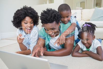 Happy family lying on the floor