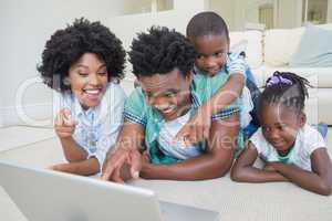 Happy family lying on the floor