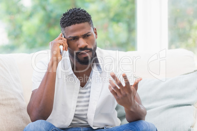 Worried man on the phone