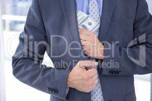 Dodgy businessman with dollar bills