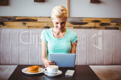 Pretty blonde using laptop computer