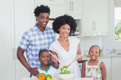 Happy family preparing vegetables together