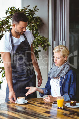 Pretty blonde arguing with the waiter