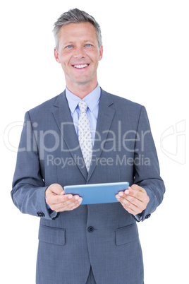 Smiling businessman against a white background