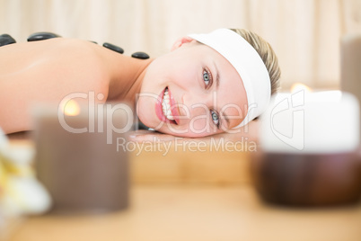 Beautiful blonde enjoying a hot stone massage