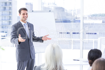 Business team looking at white screen