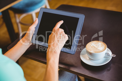 A woman using tablet computer