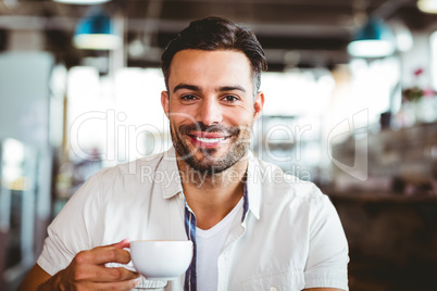 Handsome man having a coffee
