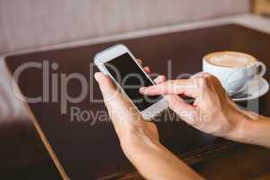 Hand of woman holding smartphone