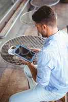 Attentive businessman using a tablet