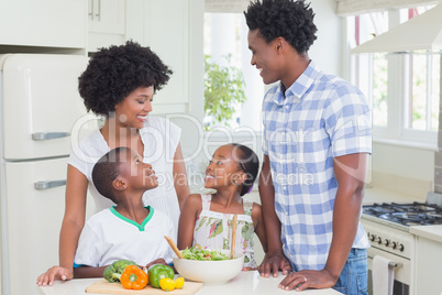 Happy family preparing vegetables together