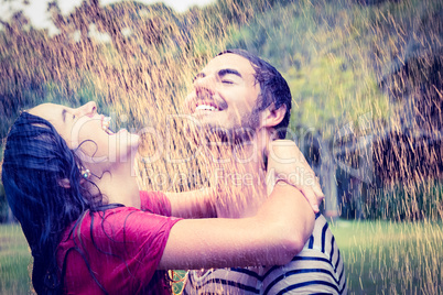 Cute couple hugging under the rain