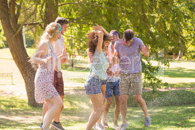 Young friends having fun with powder paint