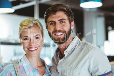 Cute couple on a date looking at the camera