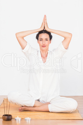 A woman in a meditation position