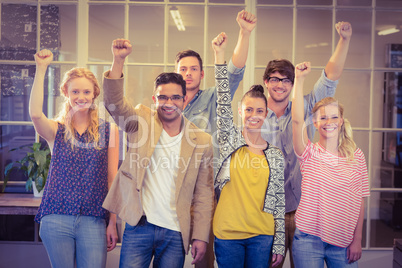 Business people cheering at the camera