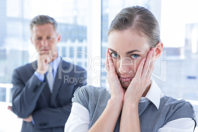 Businesswoman with hands on her face