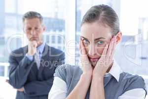 Businesswoman with hands on her face