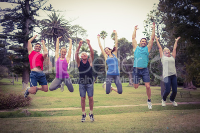 Happy athletic jumping together