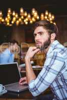 young man working on his computer