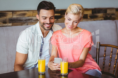 Couple taking a glass of juice