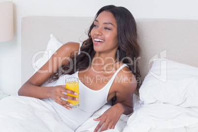 Relaxed woman drinking orange juice