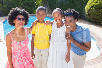 Happy family smiling at camera