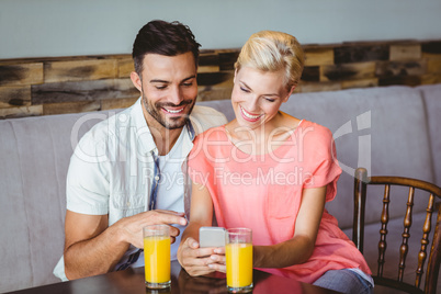 Couple taking a glass of juice Couple taking a glass of juice