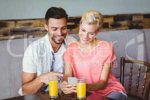 Couple taking a glass of juice