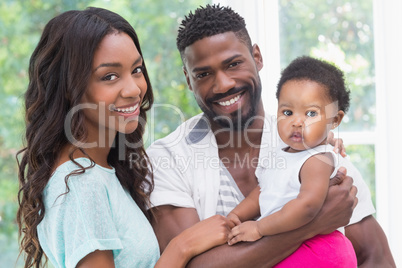 Happy parents with baby girl