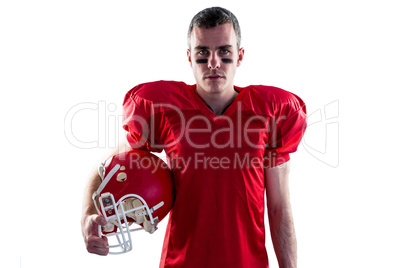 A serious american football player looking at camera