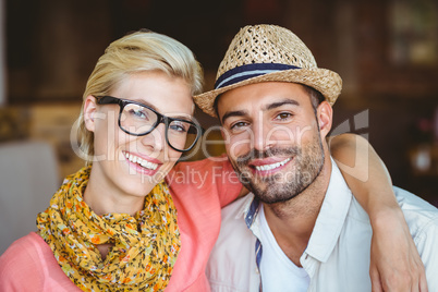 Cute couple on a date looking at the camera