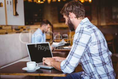 young man working on his computer