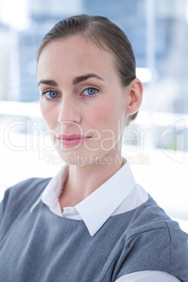 Focused businesswoman looking at the camera