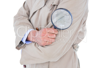 Spy looking through magnifier