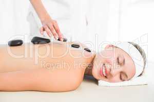 Beautiful blonde enjoying a hot stone massage