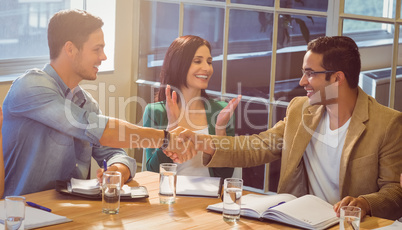 Business people shaking their hands