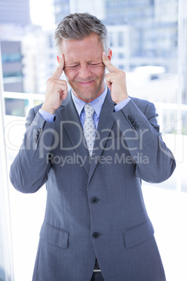 Businessman having a headache