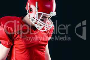 American football player taking his helmet on her head