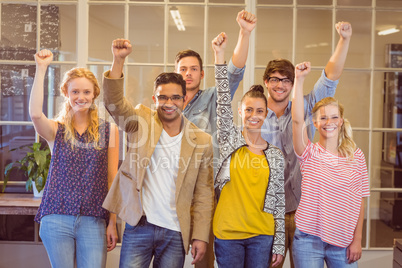 Business people cheering at the camera