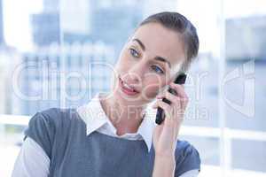 Smiling businessmwomen talking on the phone