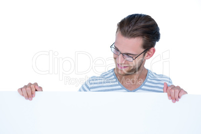 Handsome man looking at blank paper