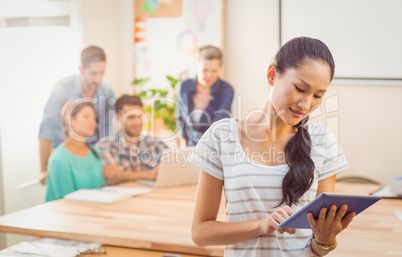Businesswoman using tablet in the office