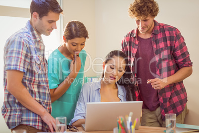 Happy team looking at their work