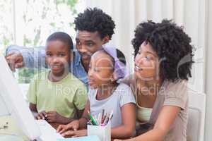 Happy family using the computer