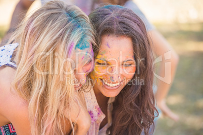 Young women having fun with powder paint