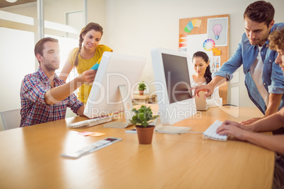 Attentive business team working on laptops